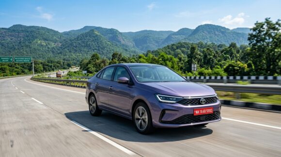 Tata Aeris compact sedan exterior front and side profile in Dandeli Drizzle lavender on Indian highway